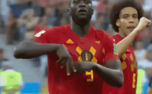 Soccer Player in Red Jersey Number 9 Celebrating Goal