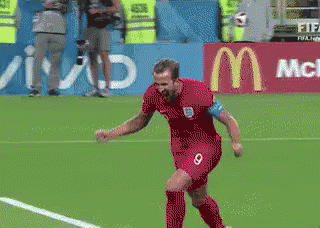 Soccer Player in Red Jersey Number 9 Celebrating Goal