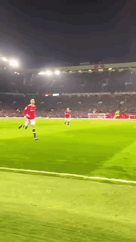 Soccer Player in Red Jersey Running