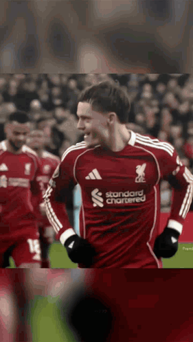 Soccer Player in Red Jersey Standard Chartered