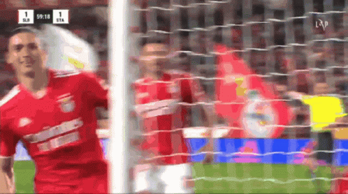 Soccer Player in Red Jersey with 1-1 Score
