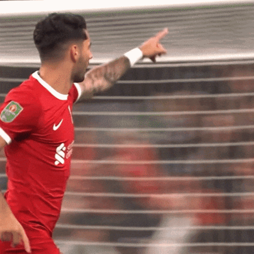 Soccer Player in Red Jersey With Santander Badge