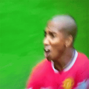 Soccer Player in Red Jersey With United Logo