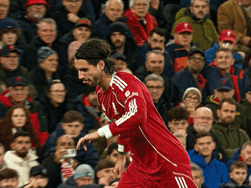 Soccer Player In Red Jersey With White Adidas Logo GIF