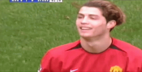 Soccer Player in Red Nike Jersey on Field