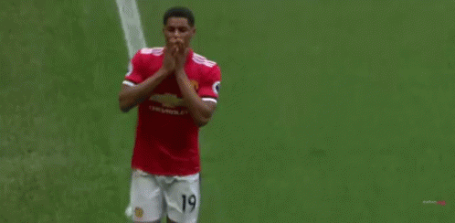 Soccer Player in Red Shirt and White Shorts