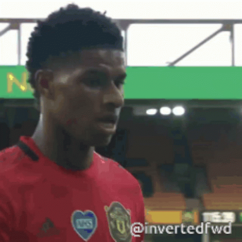 Soccer Player in Red Shirt at Stadium