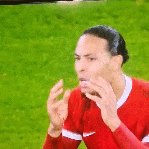 Soccer Player in Red Shirt Funny Face on TV