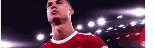 Soccer Player in Red Shirt Looking Up