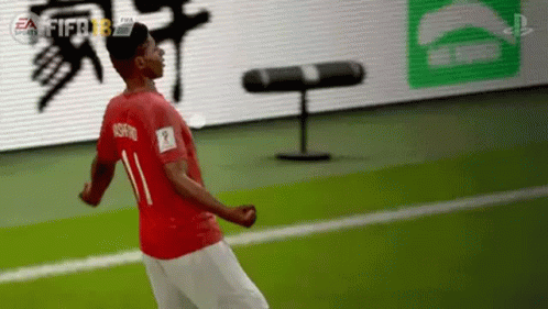 Soccer Player in Red Shirt Number 11 Jumping