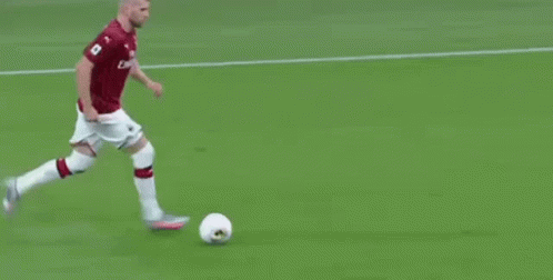 Soccer Player in Red Shirt Running