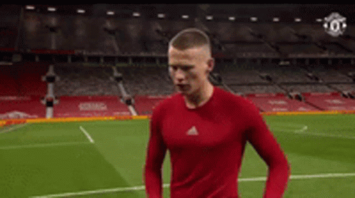 Soccer Player in Red Shirt Running