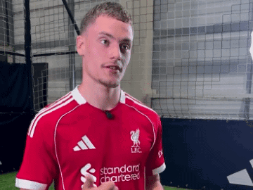 Soccer Player in Red Shirt Saying Standard Chartered