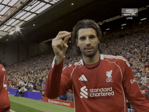 Soccer Player in Red Shirt Saying Standard