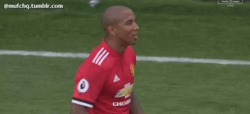 Soccer Player in Red Shirt Talking to Another Player