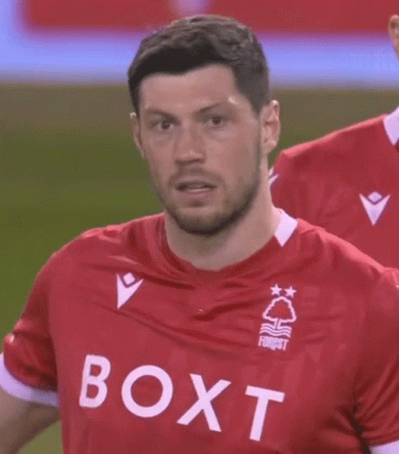 Soccer Player in Red Shirt With Boxt