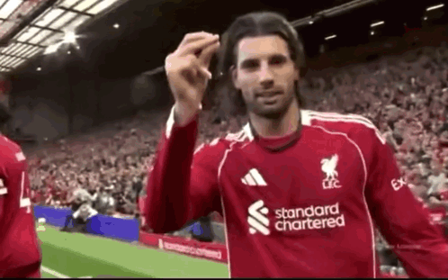 Soccer Player In Red Standard Chartered Jersey GIF