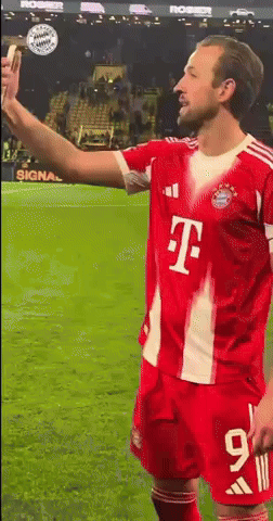 Soccer Player in Red T-Mobile Jersey Taking Selfie