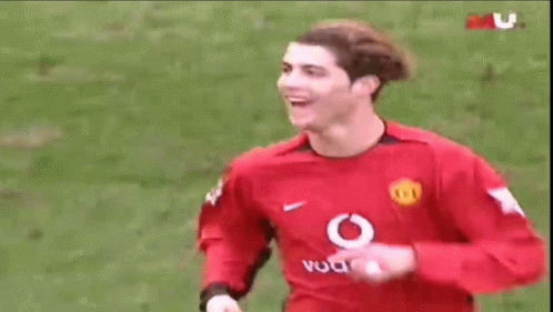 Soccer Player in Red Vodafone Jersey Smiling