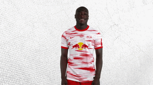 Soccer Player In Red-White Jersey With Bull GIF