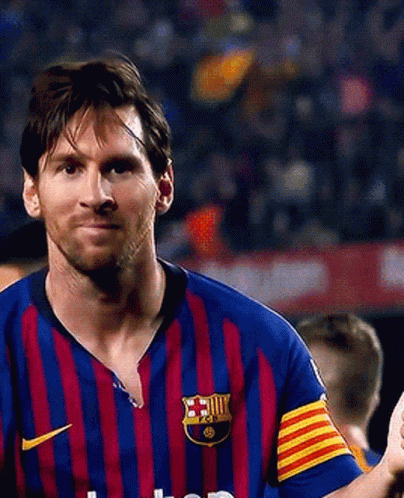 Soccer Player in Striped Jersey with FCB Logo