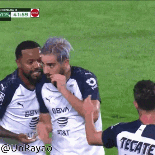 Soccer Player in Tecate Jersey Hugging Another Player