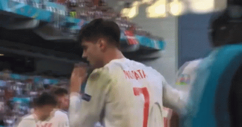 Soccer Player In White #7 Jersey Facing Crowd GIF