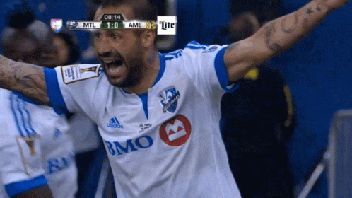 Soccer Player in White and Blue Jersey