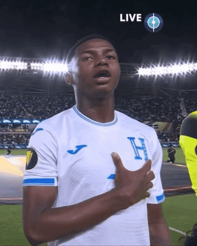 Soccer Player in White and Blue Jersey With H