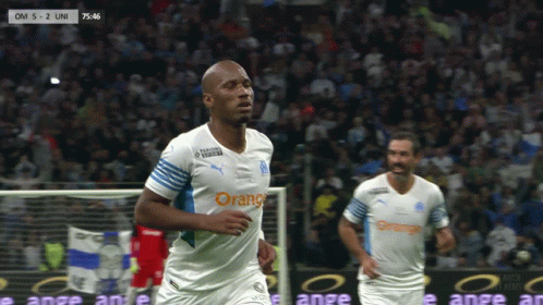 Soccer Player in White and Orange Jersey