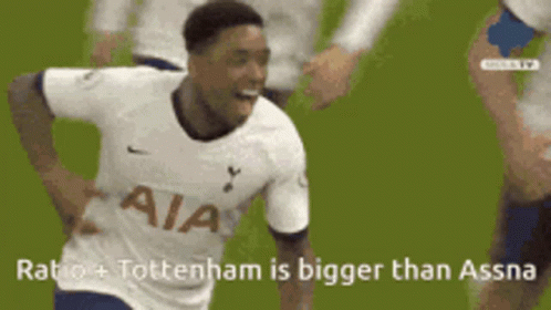 Soccer Player in White Jersey Congratulated