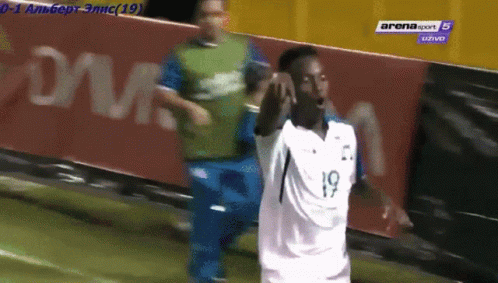 Soccer Player in White Jersey Number 19