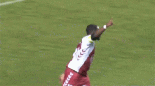 Soccer Player in White Jersey with Arrows Thumbs Up