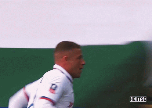 Soccer Player in White Jersey With Heitse