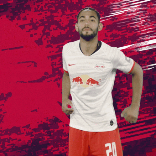 Soccer Player in White Jersey with Red Bull