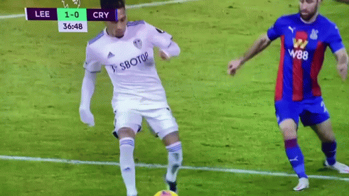 Soccer Player in White Jersey with Sbotop