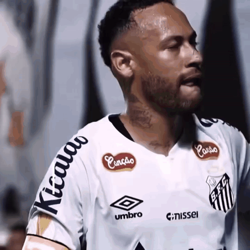 Soccer Player in White Shirt with Umbro and Nissei Logos