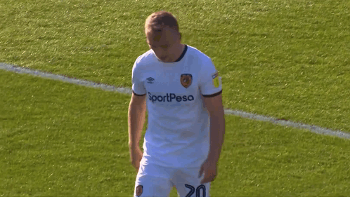 Soccer Player in White Sportpesa Jersey