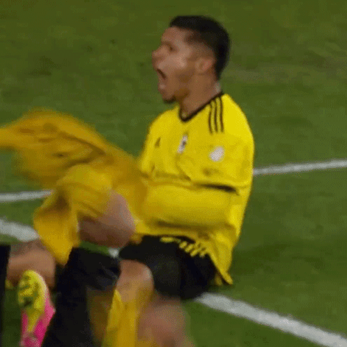 Soccer Player in Yellow Adidas Jersey Screaming