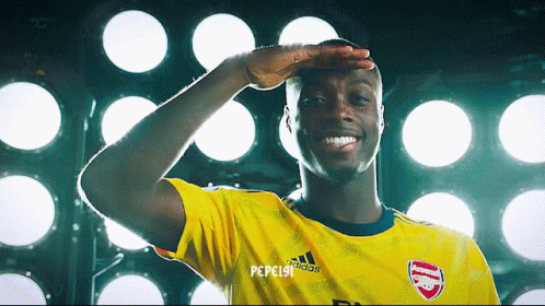 Soccer Player in Yellow Adidas Shirt Salutes