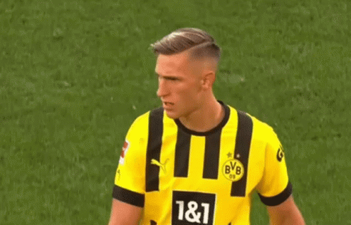 Soccer Player in Yellow and Black Jersey Number 11 on Field