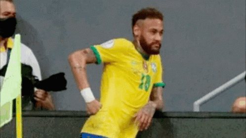 Soccer Player in Yellow and Green Jersey