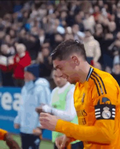 Soccer Player in Yellow Jersey Fly Emirates