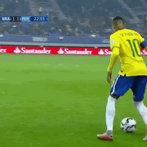 Soccer Player in Yellow Jersey Kicking Ball