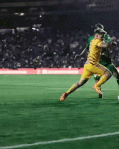 Soccer Player In Yellow Jersey Kicking Ball GIF