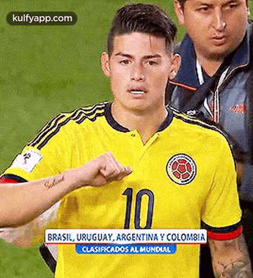 Soccer Player In Yellow Jersey Number 10 Walking On Field GIF