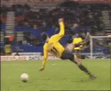 Soccer Player in Yellow Jersey Number 11 Falling