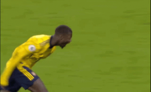 Soccer Player in Yellow Jersey Running