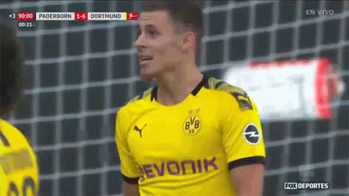 Soccer Player in Yellow Jersey Saying Evonik