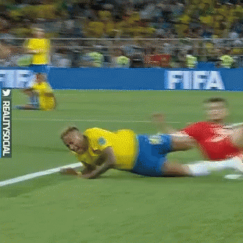Soccer Player in Yellow Lying on Field